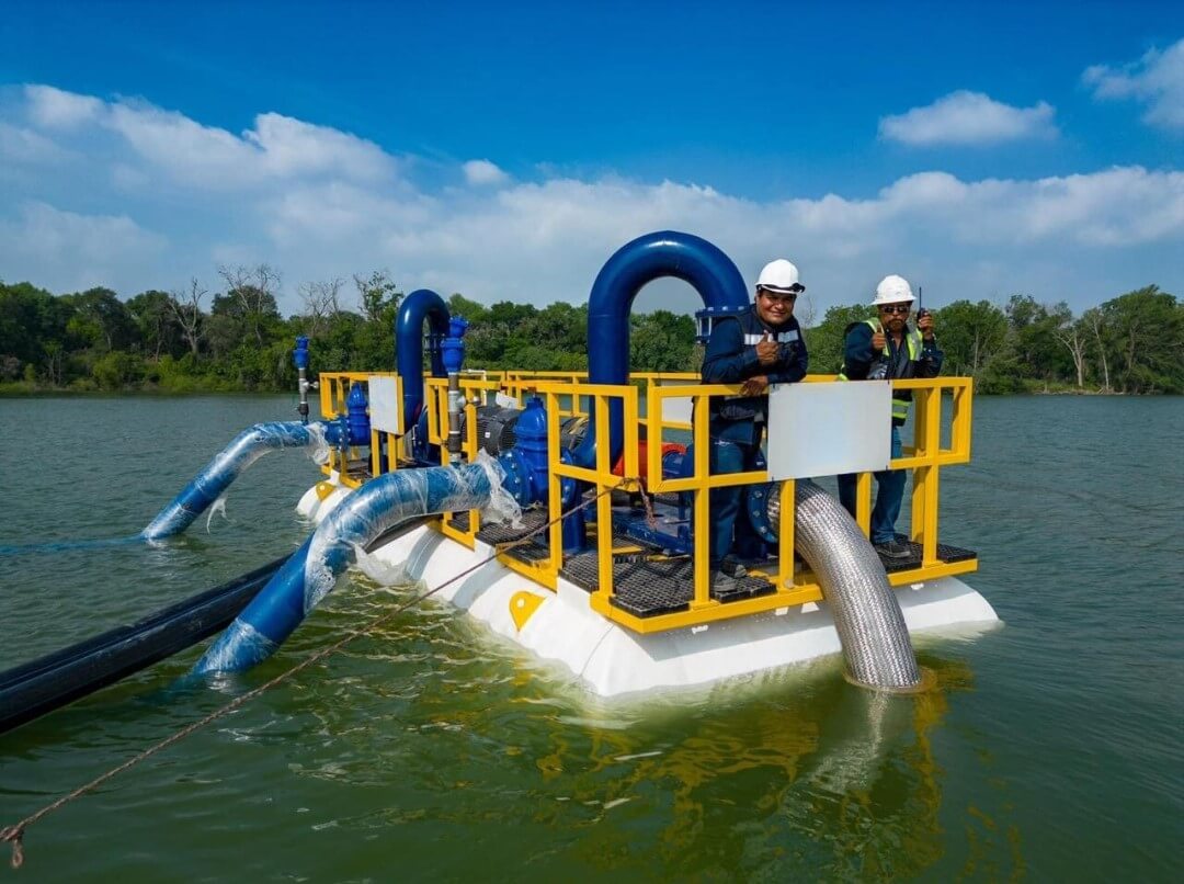 FRP floating platform with molded grating deck and structural handrail supporting pumping equipment over water